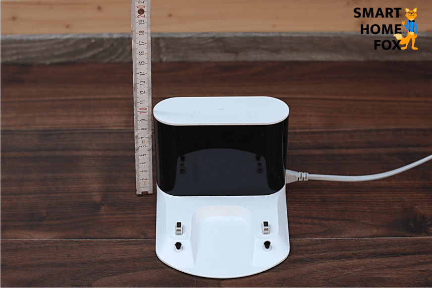 Measuring the height of the charging dock with a ruler